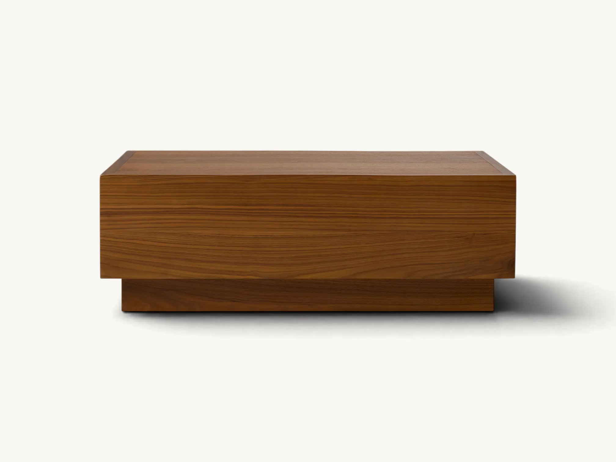 Modern teak wood coffee table with plinth base and dual side drawers.