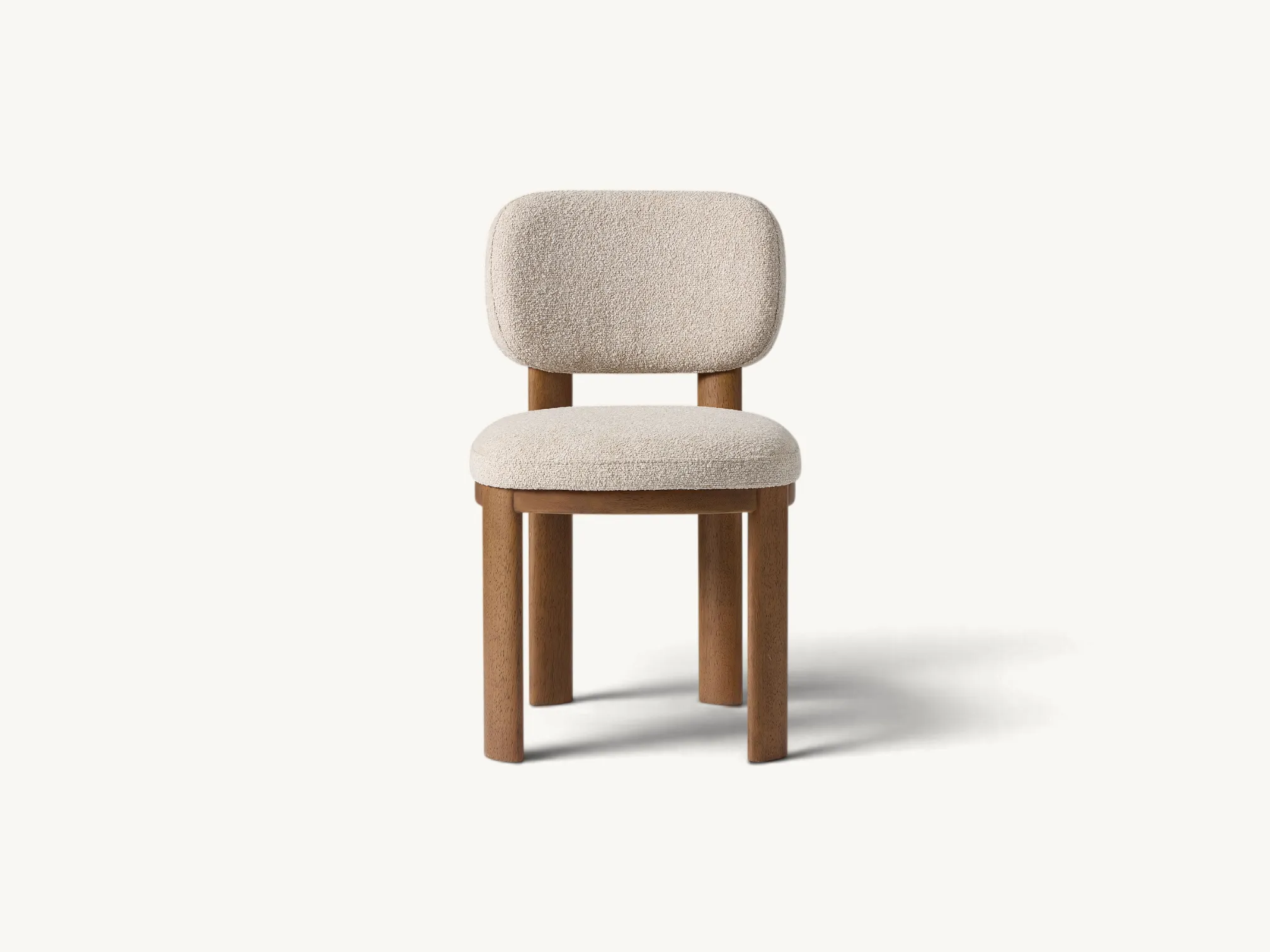 Japandi style solid teak wood dining chair with cream bouclé upholstery and thick cylindrical legs.
