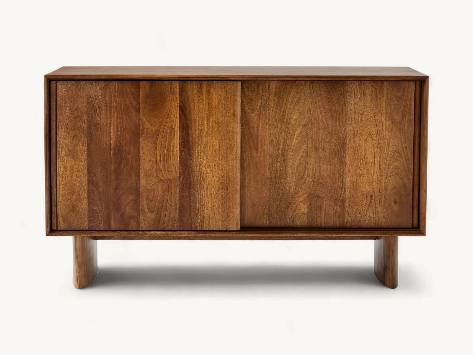Rich dark-toned solid teak media sideboard featuring two large sliding doors and distinctive curved architectural legs.