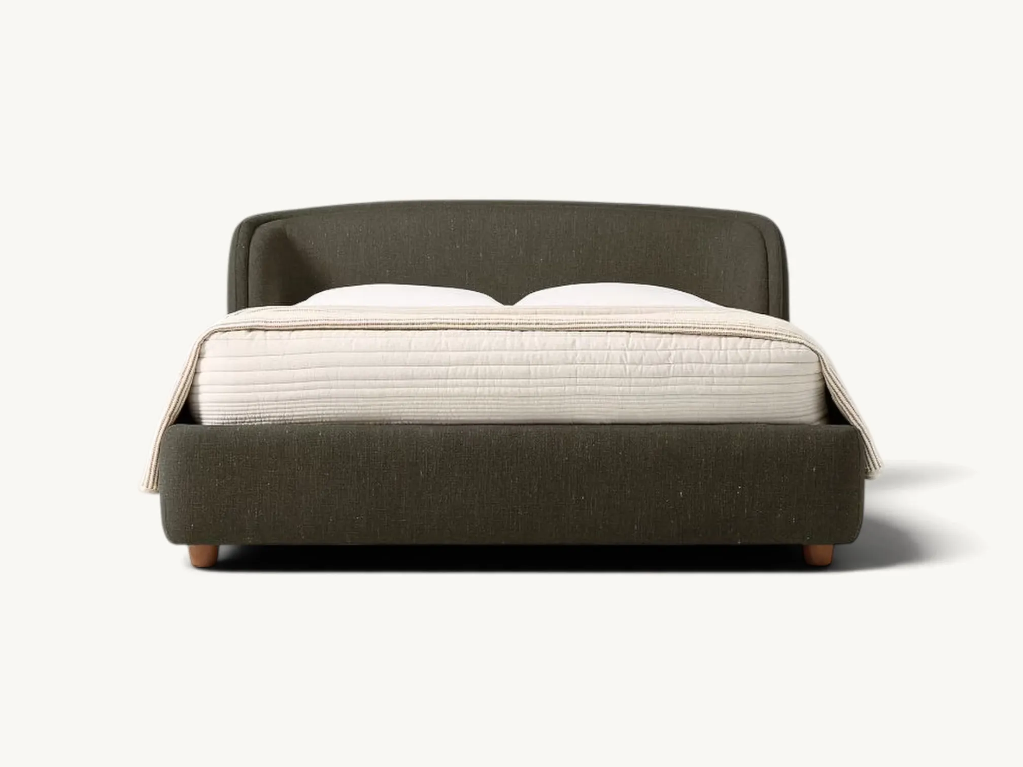 Modern low-profile upholstered platform bed in dark olive green fabric with a curved headboard and natural wood feet.