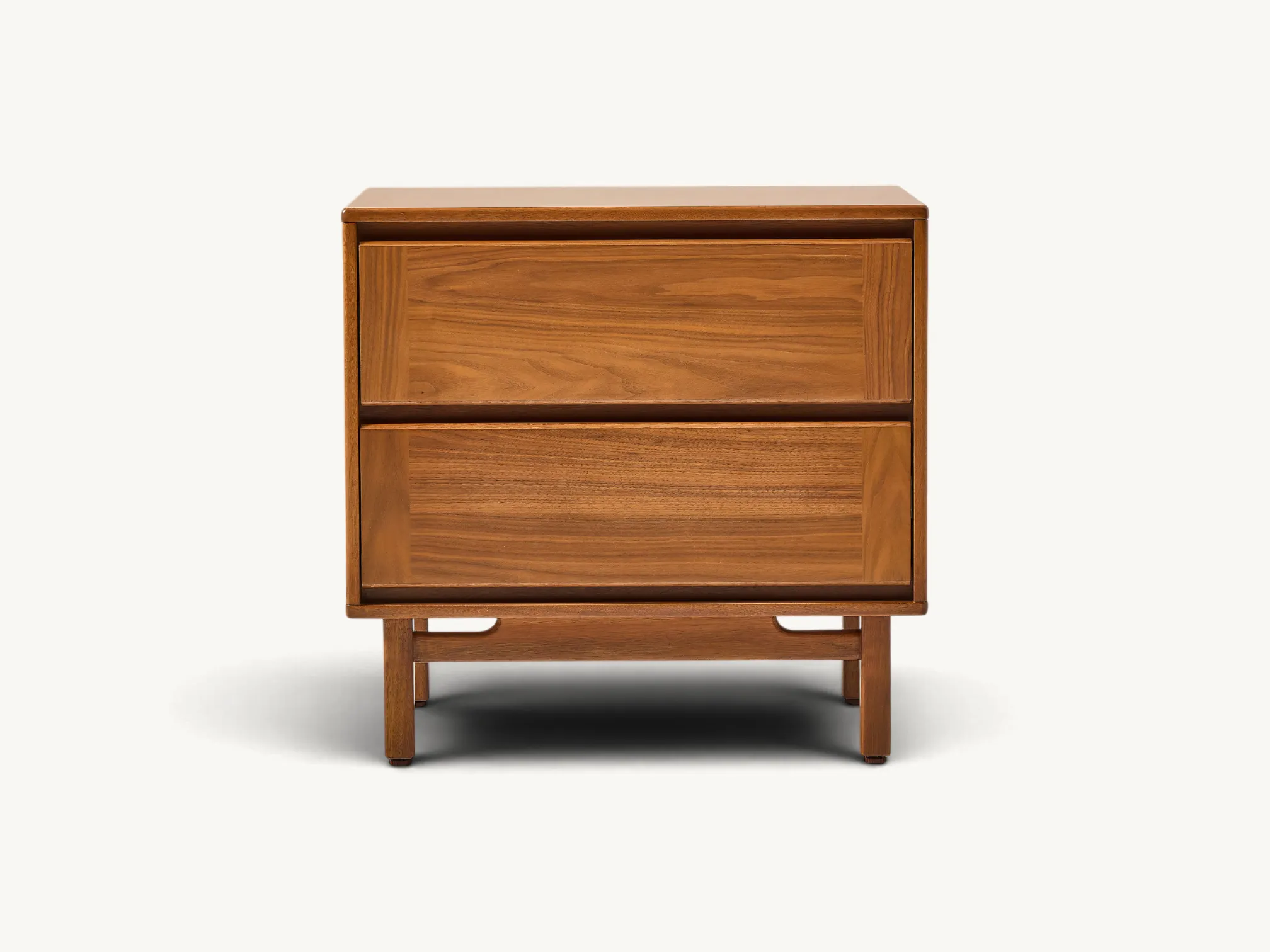 Minimalist teak wood nightstand featuring two wide drawers with integrated finger pulls and a tapered leg base with a curved crossbar.