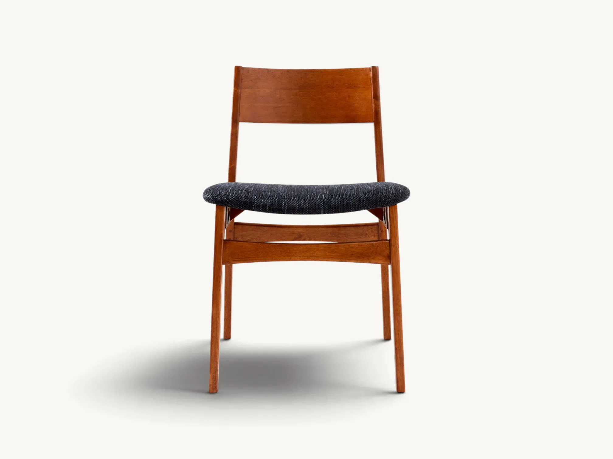Mid-Century Modern solid teak armchair with angular wooden frame and charcoal grey upholstery.