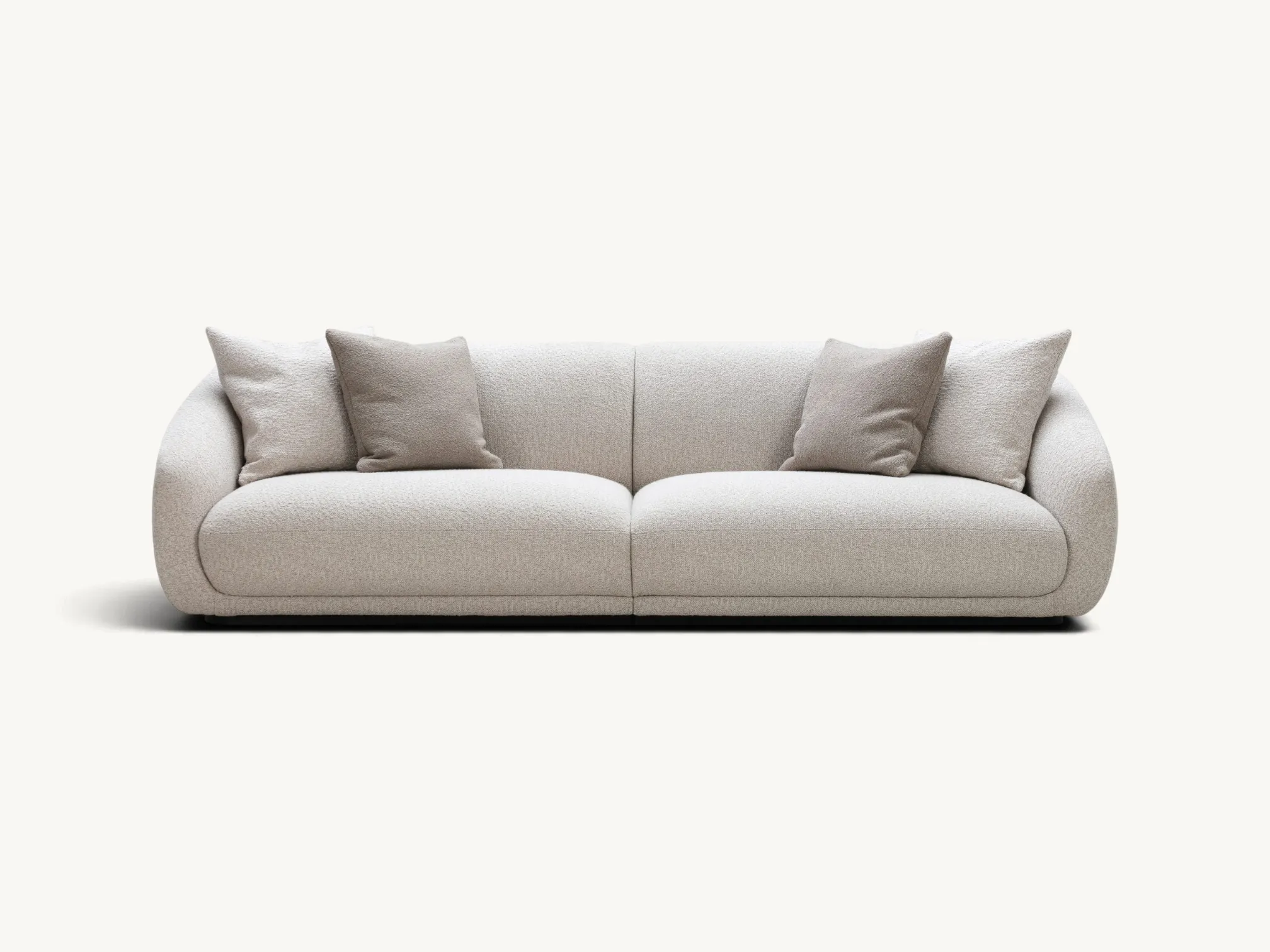 Modern organic curved sofa in textured light grey bouclé fabric with hidden teak wood base.