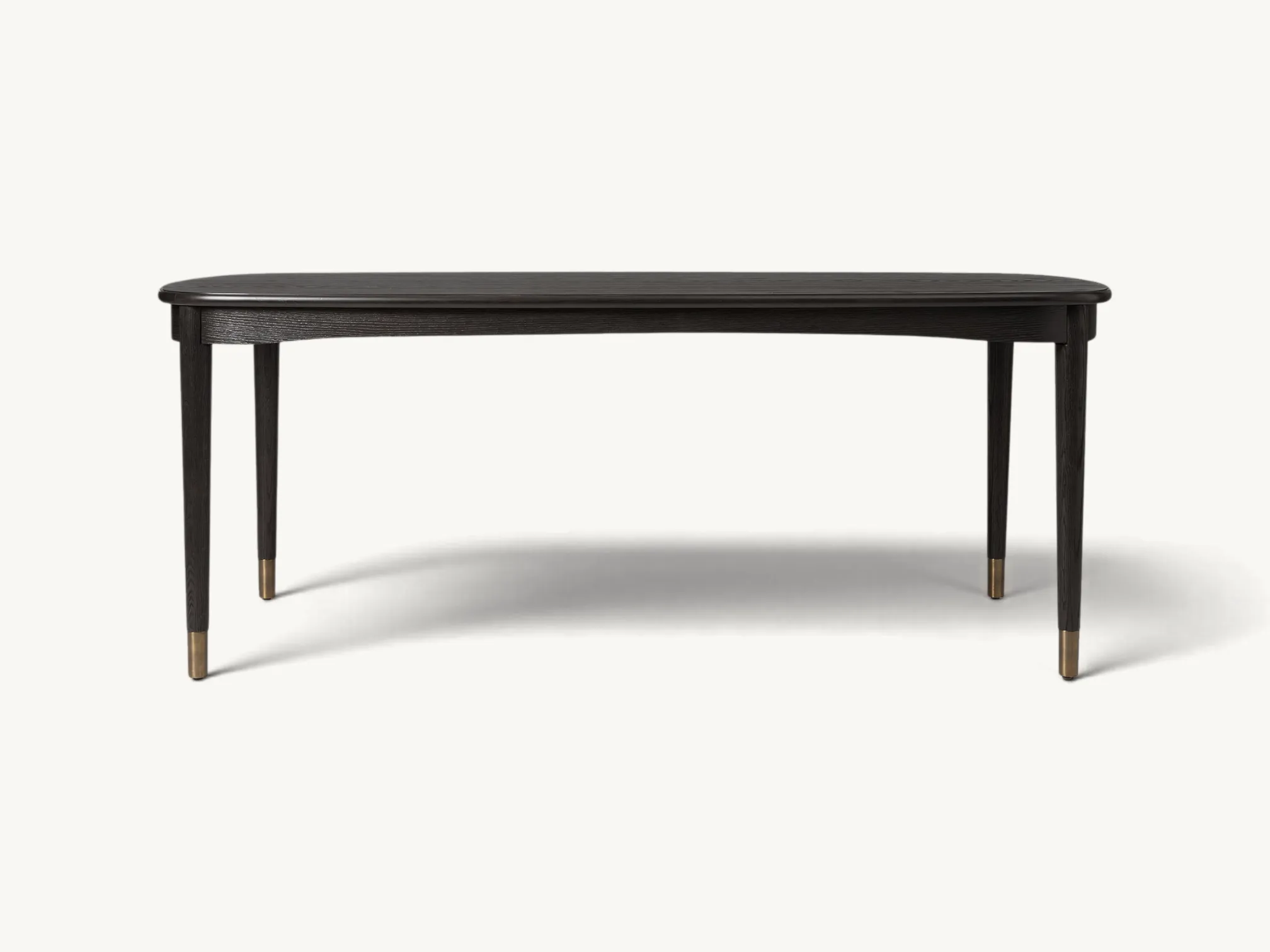 Mid-Century Modern teak dining table with tapered legs and brass accents.