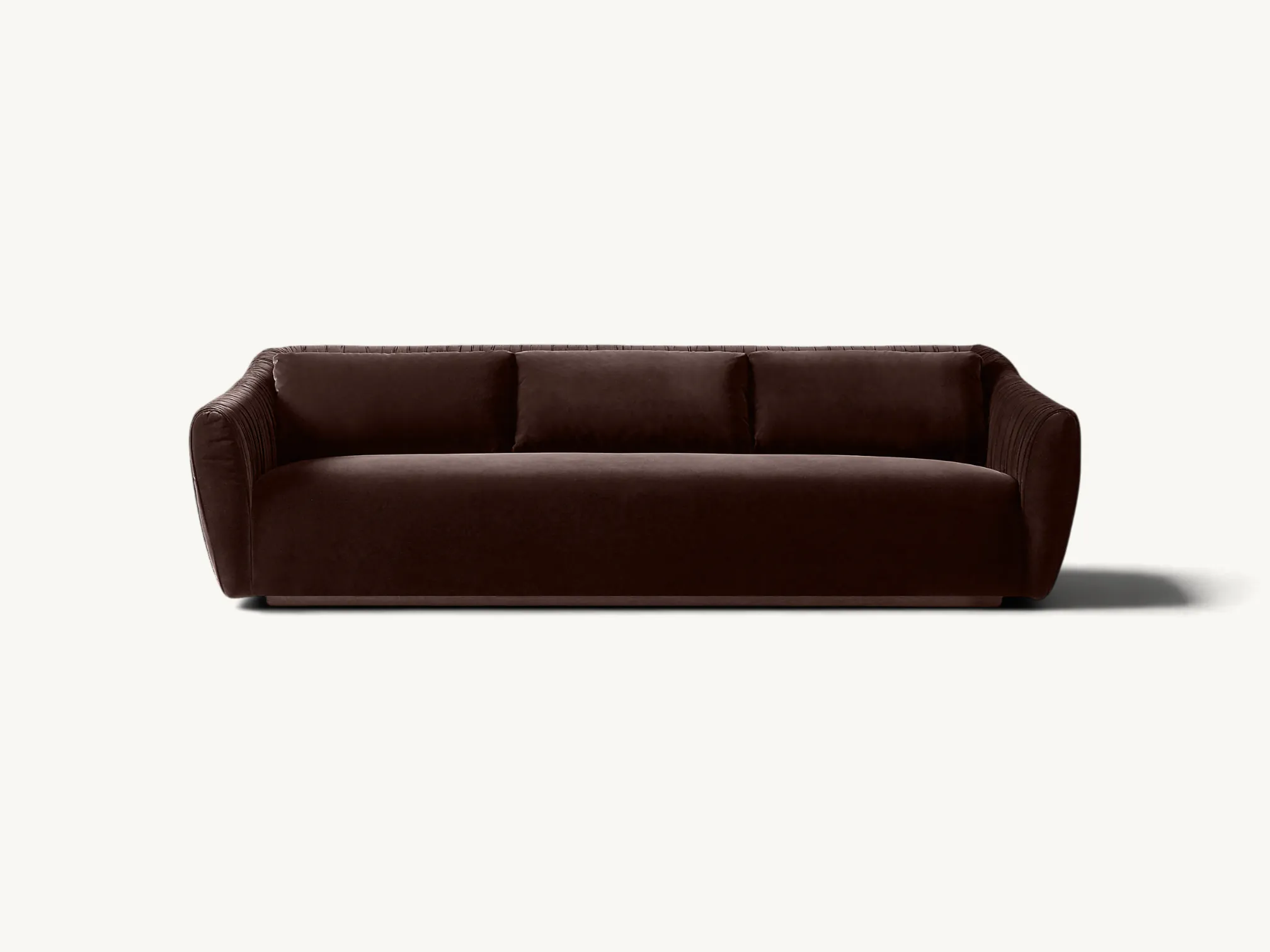 Modern deep brown velvet sofa with pleated side details and a solid teak wood base.