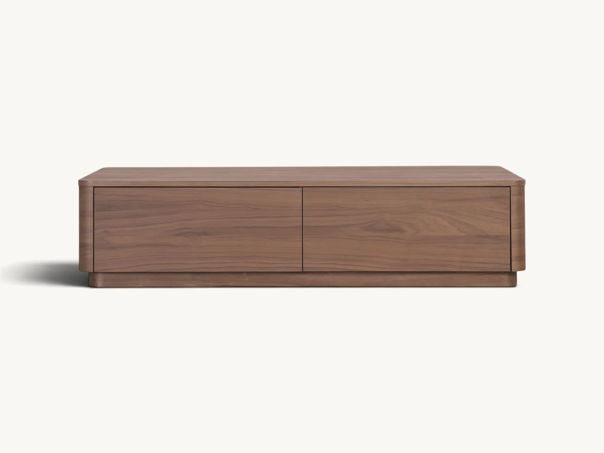 Minimalist rectangular teak wood storage coffee table with rounded corners and two seamless handleless drawers on a recessed plinth base.