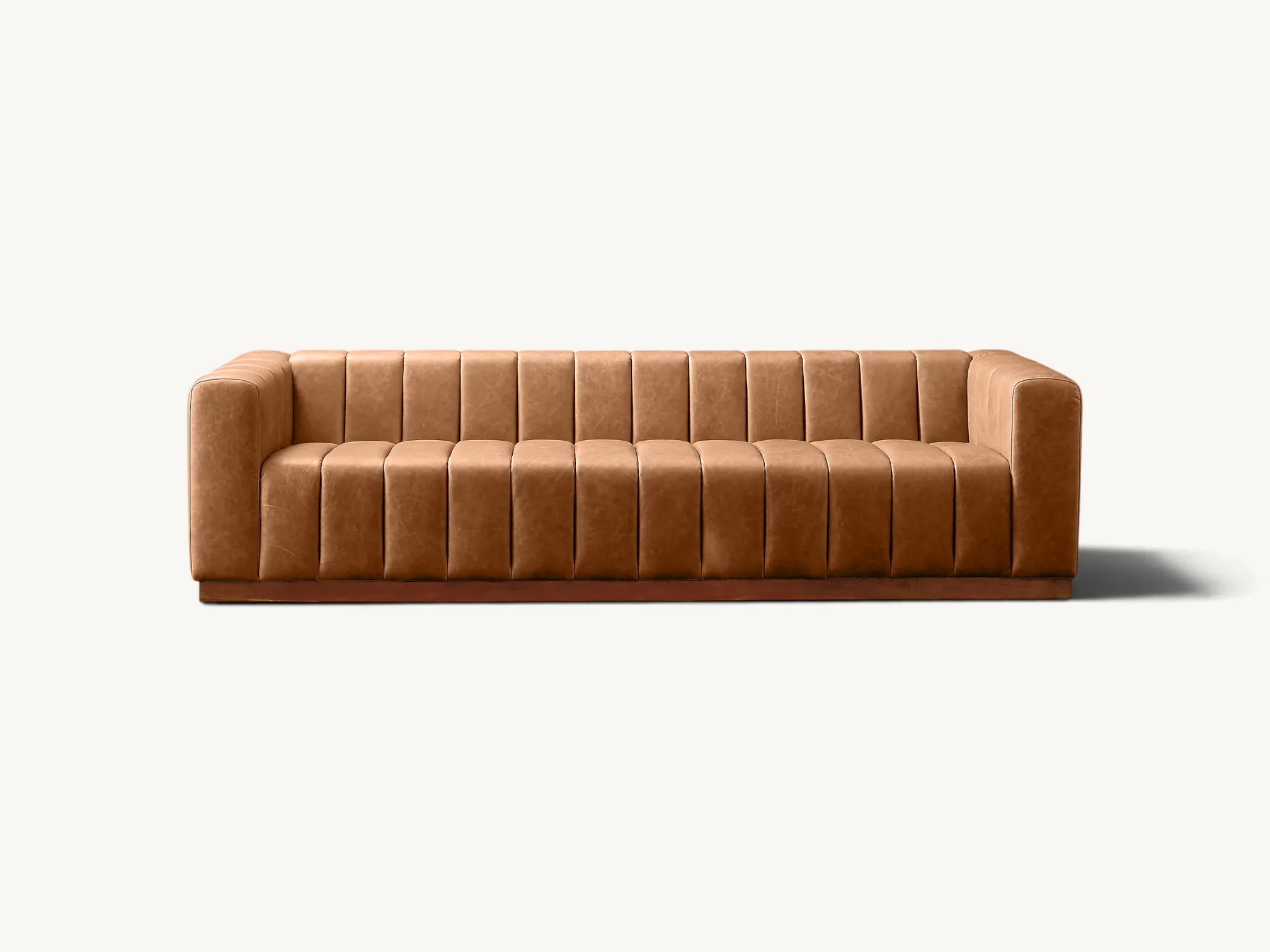 Tan leather channel-tufted sofa with a dark-stained solid teak wood base.