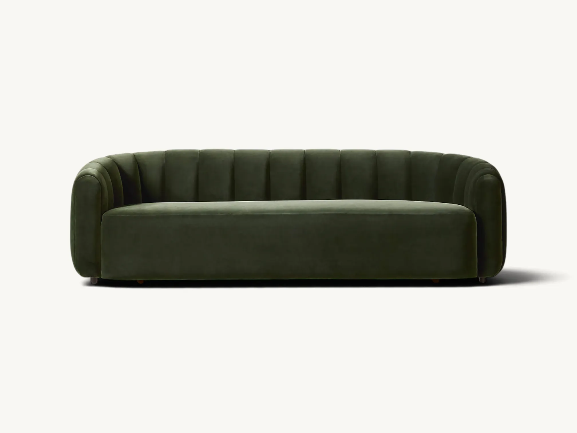 Curved olive green velvet sofa with wide vertical channel tufting and a rounded contemporary design.