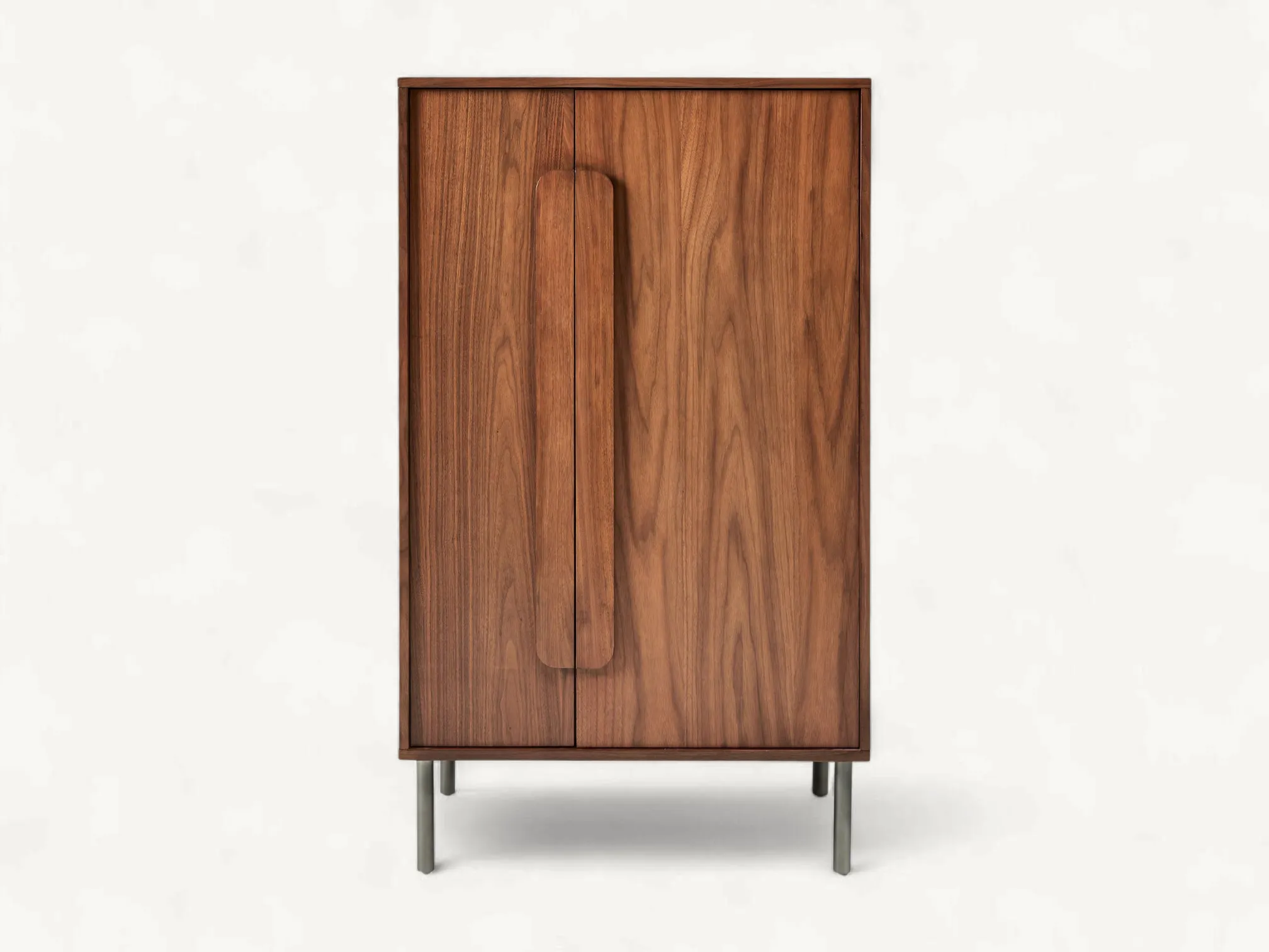 Richly grained teak wood cabinet with elongated vertical handles and slender tapered metal legs.