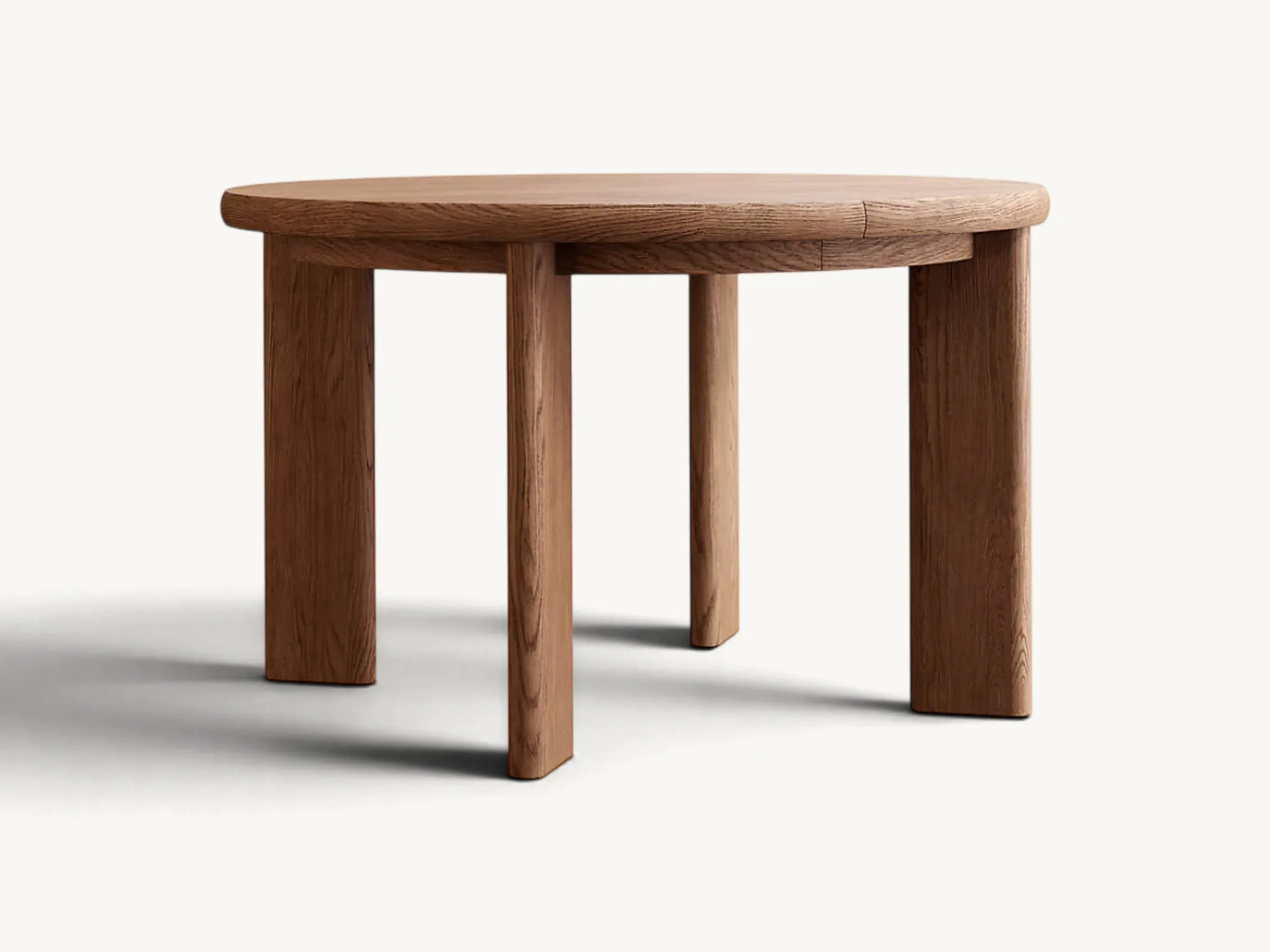 Round natural wood extendable dining table with sturdy cylindrical legs and smooth bullnose tabletop edges