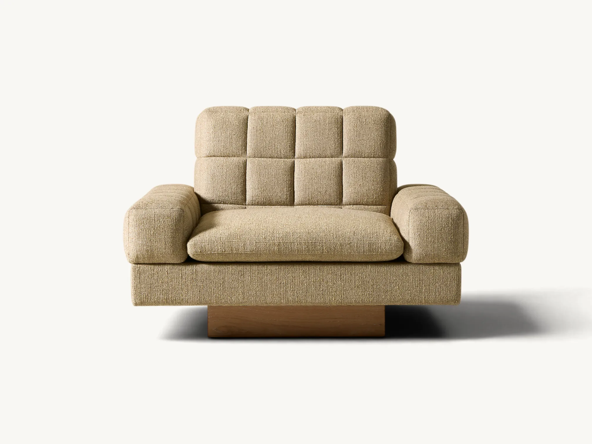 Minimalist curved sofa on an extended solid teak wood platform base with cylindrical legs.