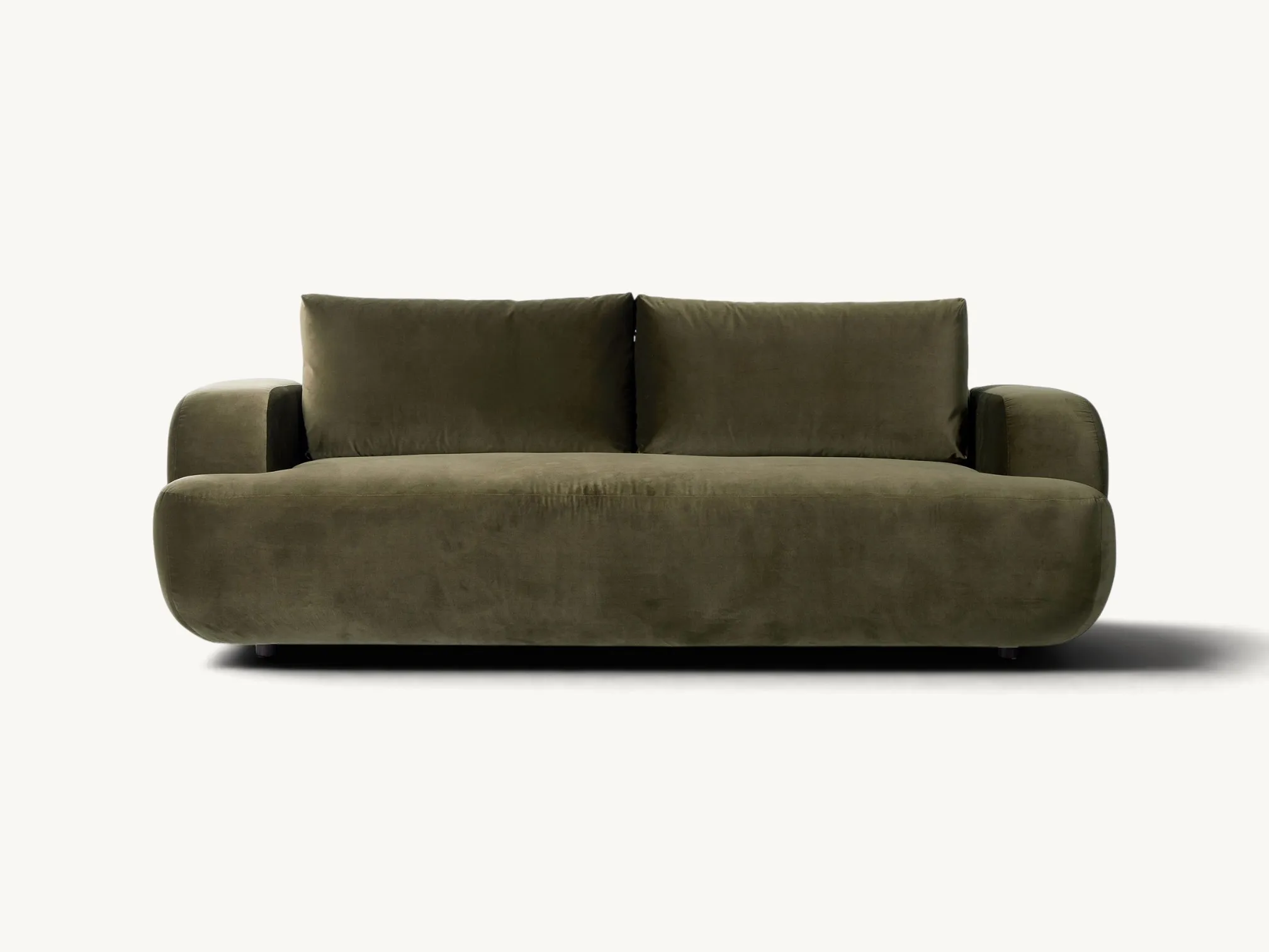 Luxurious olive green velvet sofa with a rounded, low-profile design in a contemporary living room setting.