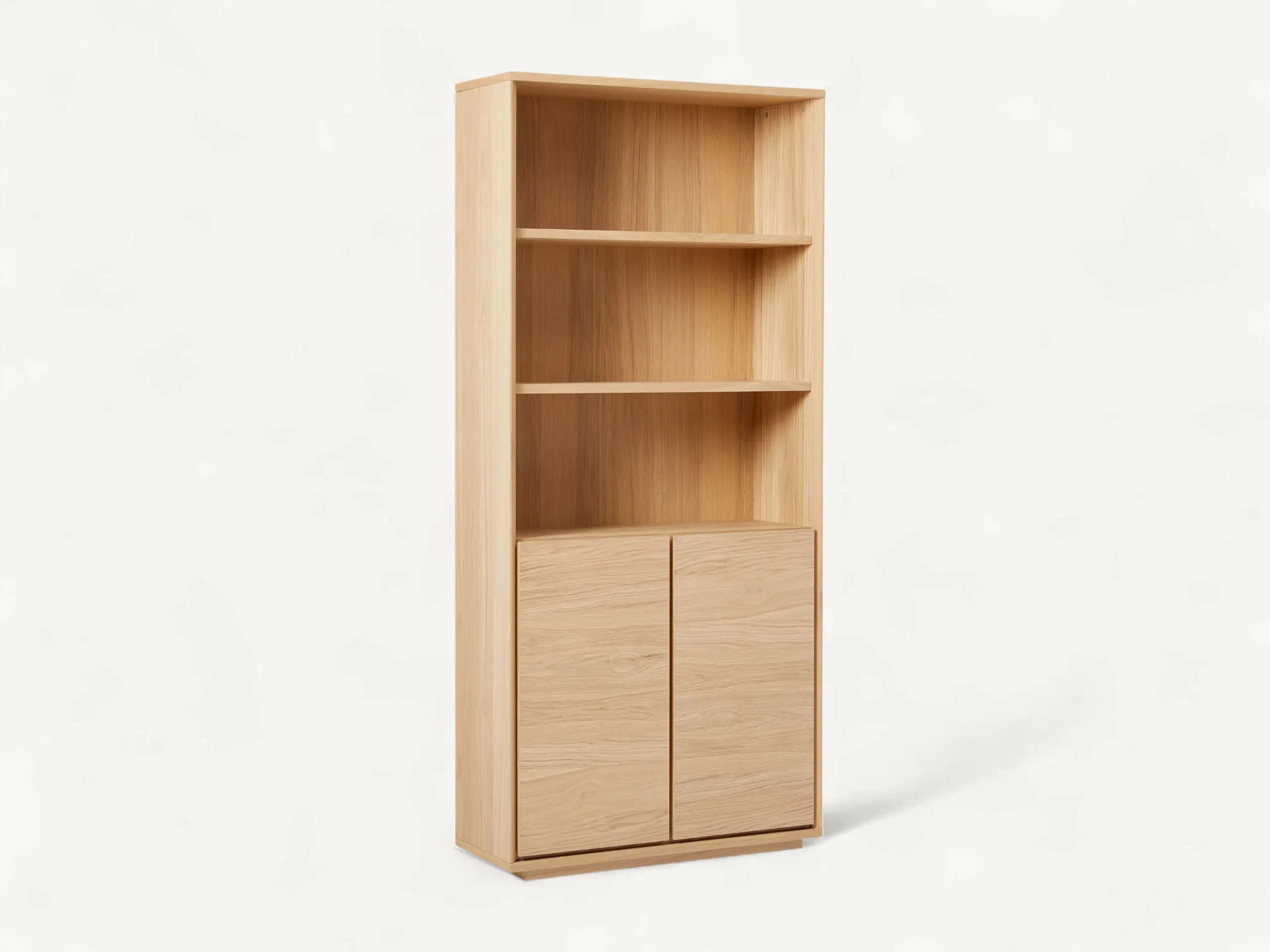 Japandi natural teak wood bookshelf with three open shelves and a bottom double-door storage cabinet.