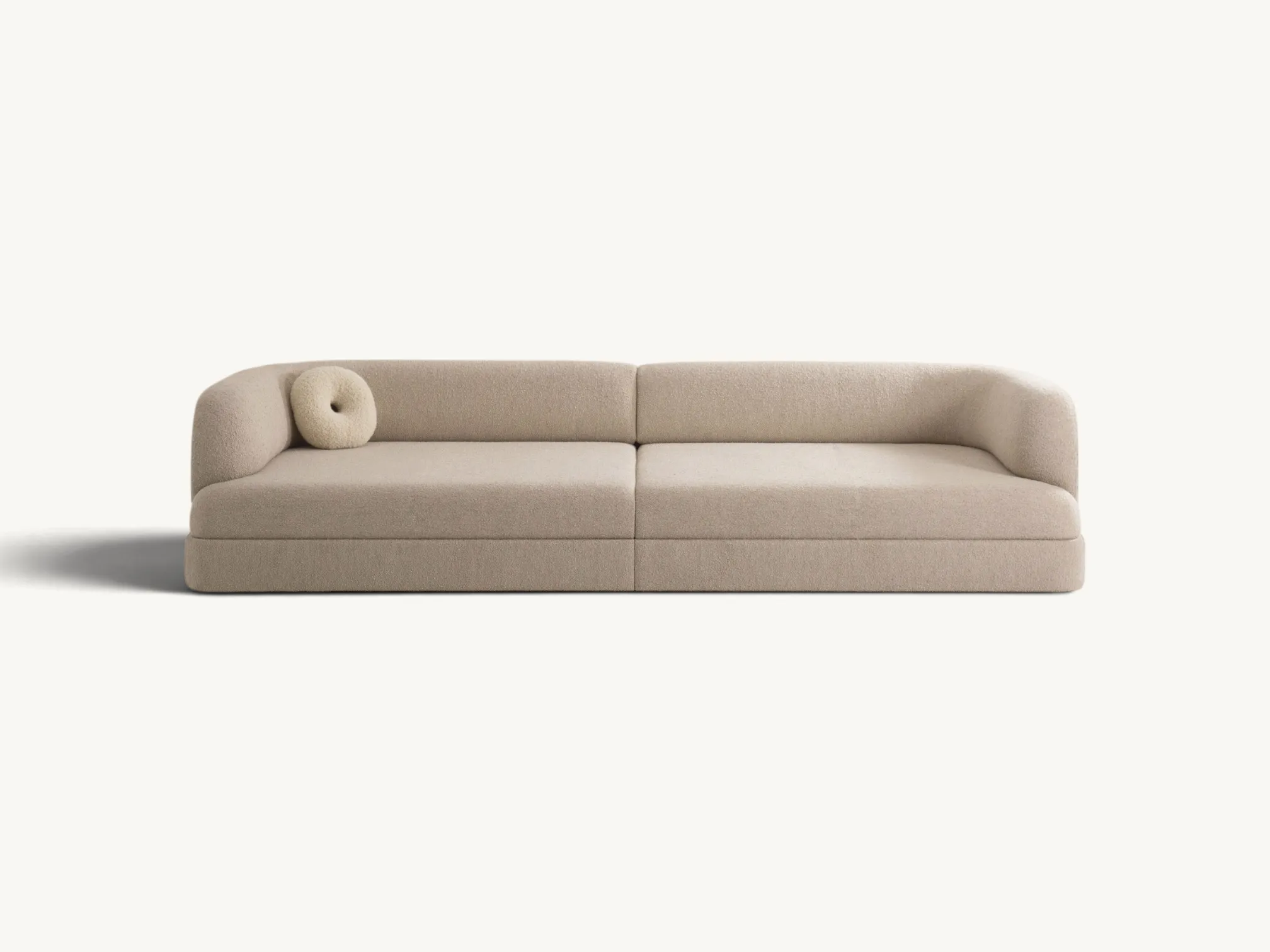 Modern Japandi style two seater sofa in beige bouclé fabric with curved armrests and low-profile minimalist design.