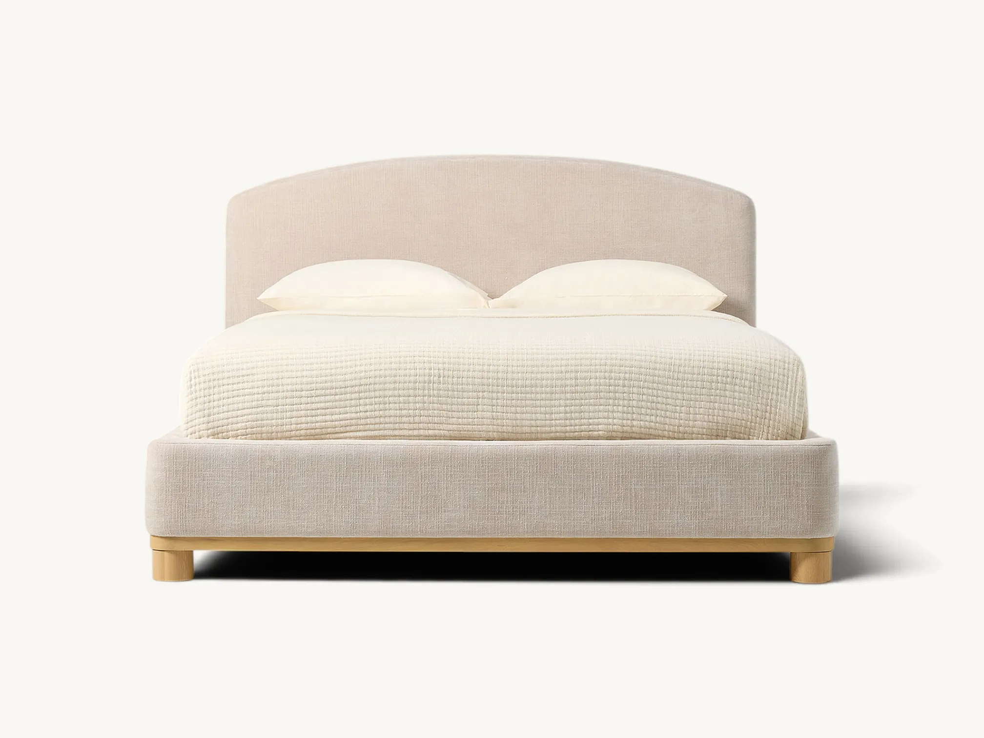 Modern upholstered bed frame with arched headboard and natural teak wood base.