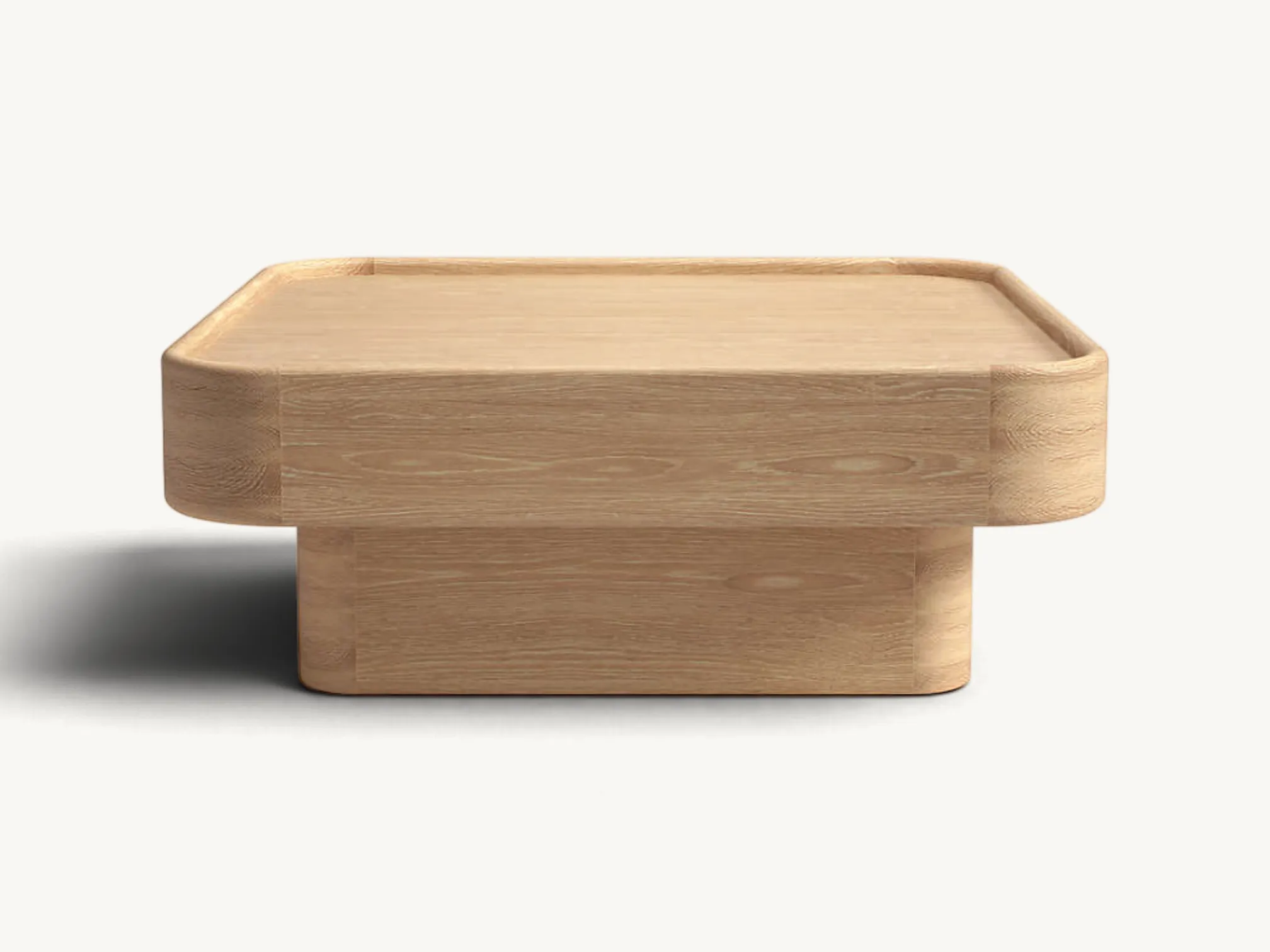 Low-profile square wooden coffee table with smooth rounded corners, raised edges, and a thick recessed pedestal base