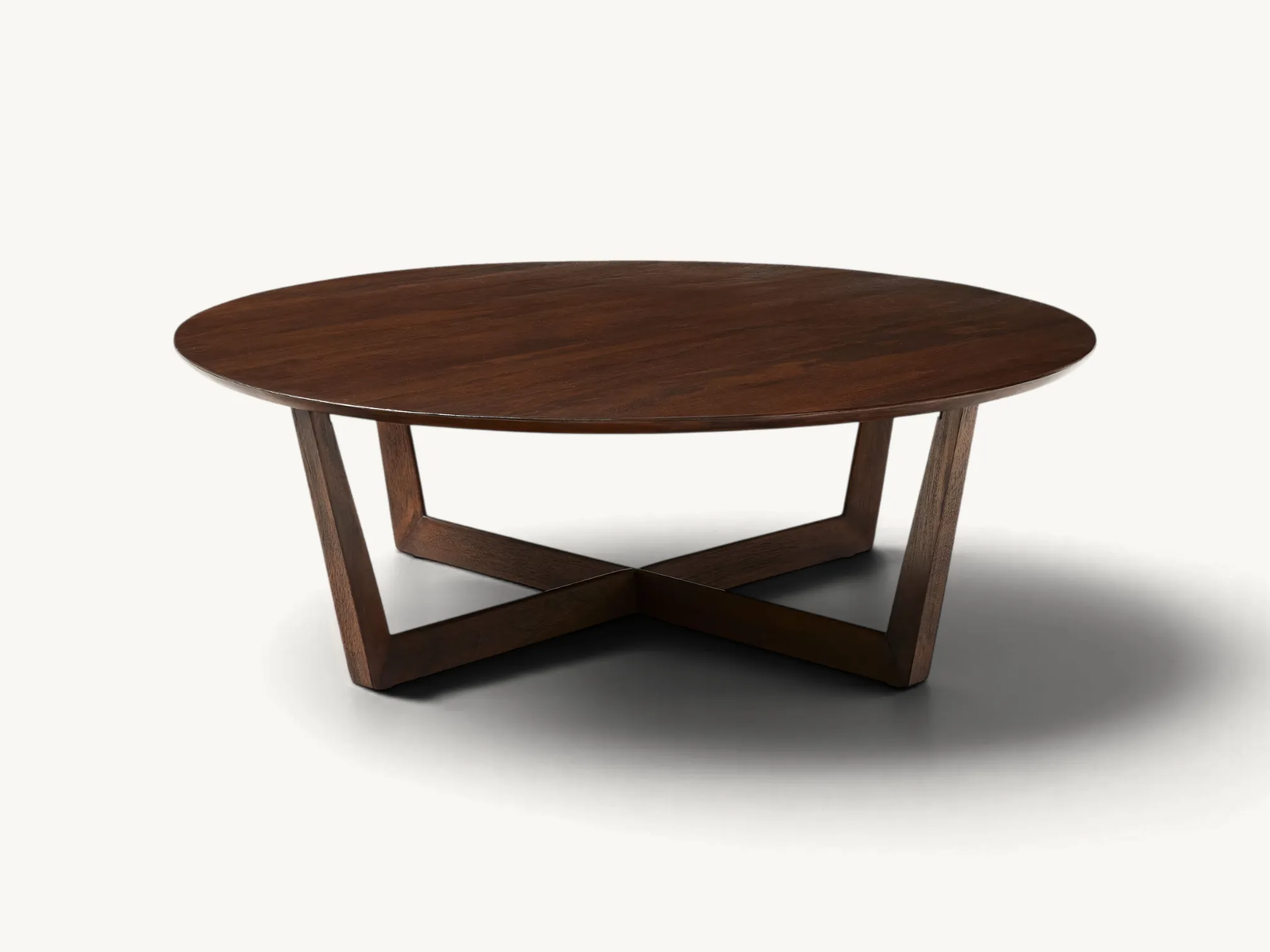 Modern round coffee table made of dark-stained solid teak wood with a geometric X-shaped base.