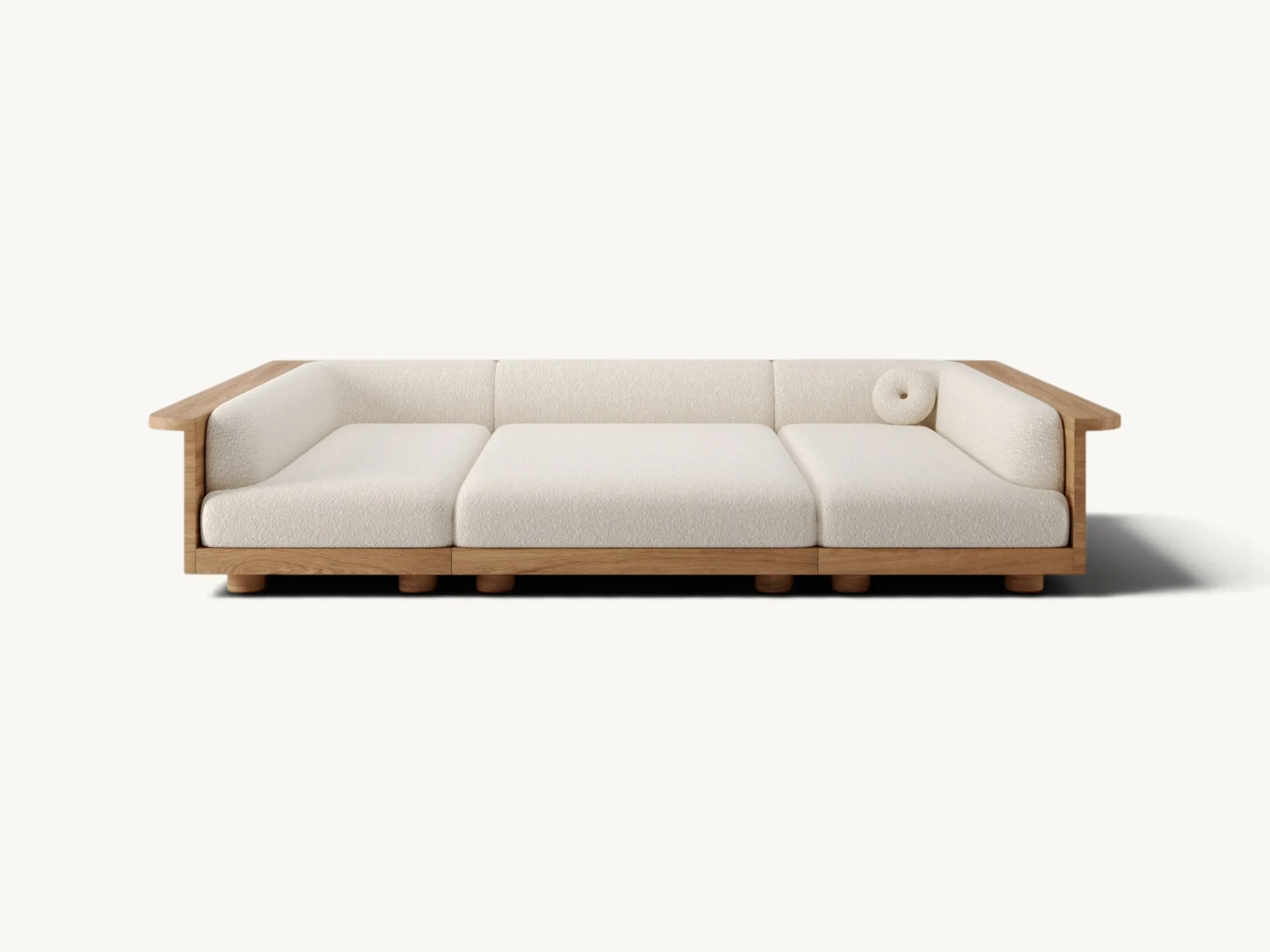 Low-profile Japandi style sofa featuring a solid teak wood frame with natural grain and soft white bouclé fabric cushions.